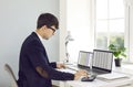 Man office worker is working with spreadsheets on computers screens and making calculations. Royalty Free Stock Photo