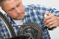 Man Oiling Bicycle Chain