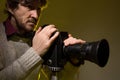 Man with old film movie camera. Royalty Free Stock Photo