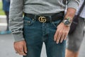 Man with Omega watch and Gucci belt before Giorgio Armani fashion show, Milan Fashion Week street style on