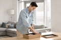 Man open parcel box, feel satisfied with quality, express delivery Royalty Free Stock Photo
