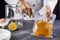 Man opening bag with kombucha SCOBY