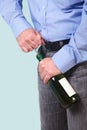 Man opening a bottle of white wine Royalty Free Stock Photo
