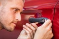 Man Opening Car Door With Lockpicker Royalty Free Stock Photo