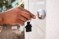 Man opening the door of his new house. Royalty Free Stock Photo