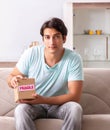 Man opening fragile parcel ordered from internet