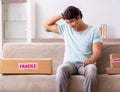 Man opening fragile parcel ordered from internet