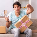 Man opening fragile parcel ordered from internet