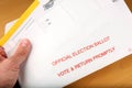 Man opening mail in ballot Royalty Free Stock Photo