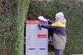 Man Opening the Mailbox of the Canada Post Royalty Free Stock Photo