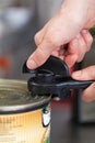 Man opening a tin of canned food