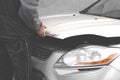 Car master opened the hood. Man opens car bonnet for engine inspection