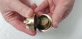 A man opens small golden piggy bank