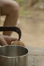 Man opens tropical coconuts at traditional food