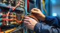 A man operates an electric blue server in a glass data center. AIG41 Royalty Free Stock Photo