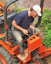 Man operating backhoe