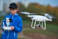 Young man operating of flying drone at sunset Royalty Free Stock Photo