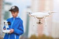 Young man operating of flying drone at sunset Royalty Free Stock Photo