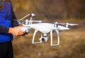 Man operating drone flying by remote control Royalty Free Stock Photo
