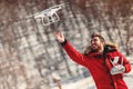 Man operating drone with remote control radio controlled device. Modern technology details Royalty Free Stock Photo