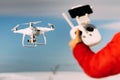 Man operating drone with remote control radio controlled device. Modern technology details Royalty Free Stock Photo