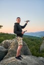 Man operating drone using remote controller. Royalty Free Stock Photo