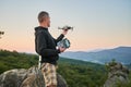Man operating drone using remote controller. Royalty Free Stock Photo