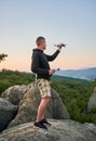 Man operating drone using remote controller. Royalty Free Stock Photo