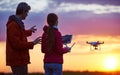 Man operating of flying drone at sunset Royalty Free Stock Photo