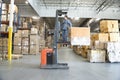 Man Operating Forklift Truck In Warehouse