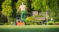 Man Operating Lawn Aerator on Grass Field Royalty Free Stock Photo