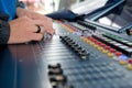 Man operating studio audio mixer Royalty Free Stock Photo