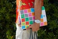 Man with orange shirt with floral decorations and white ice watch before Pal Zileri fashion show, Milan Fashion