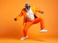 Multiethnic man motion trendy action style guy black orange adult handsome fashion funny jump modern