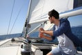 Man orienting the sails on a boat Royalty Free Stock Photo