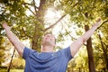 Man Outdoors In Fitness Clothing Stretching Arms And Celebrating Nature