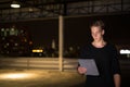 Man Outdoors At Night Using Digital Tablet Royalty Free Stock Photo