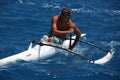 Man in Outrigger Canoe Royalty Free Stock Photo