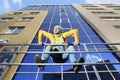 Man in overalls on background glassed building Royalty Free Stock Photo