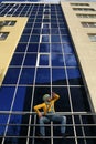 Man in overalls on background glassed building Royalty Free Stock Photo