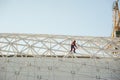 Man in overalls builder fixes on the height