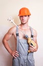 Man in overalls with a mixer for plastering Royalty Free Stock Photo