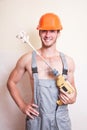 Man in overalls with a mixer for plastering Royalty Free Stock Photo