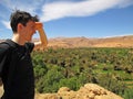 Man overlooking oasis