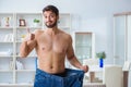The man in oversized pants in weight loss concept Royalty Free Stock Photo