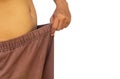 Man in oversized pants on white in weight loss concept Royalty Free Stock Photo