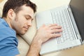 Man overslept by laptop Royalty Free Stock Photo