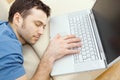 Man overslept by laptop Royalty Free Stock Photo