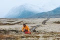 Man packing backpack travel hiking gear in mountains