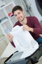 Man packing clothes into travel bag Royalty Free Stock Photo